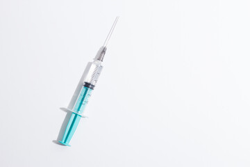 Medical syringe on a white background. A syringe for injection. The concept of health and beauty