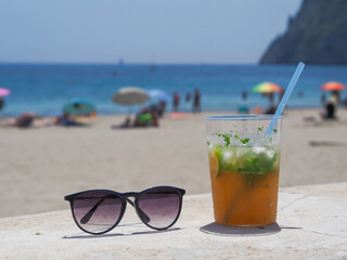 Mojito on the beach, refreshing drink, vacation at sea.