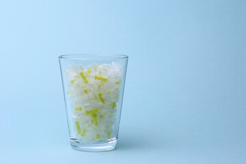 Glass of insulin needles isolated with copy space