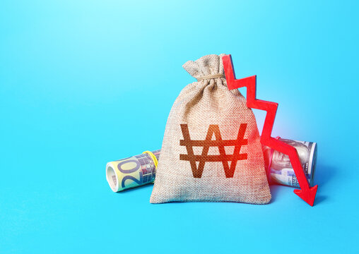 South korean won money bag and arrow down. Drop in profits. Decrease in interest rate deposit rate. Inflation. Low real incomes, economic difficulties. Recession and depression. Falling economy.