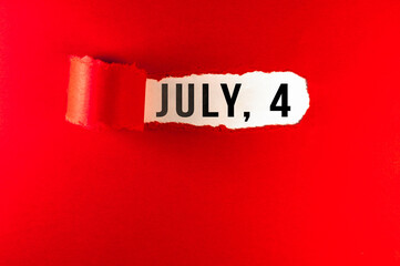 July 4 message on red paper torn ripped opening. Hollyday concept. Independence Day.