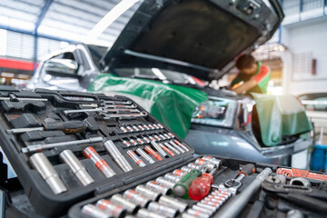 Auto mechanic working in Car repair station. Repair service. select focus equipment or wrenches for car repairs.
