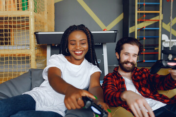 International couple playing a video games