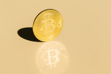 Bitcoin on beige background with copy space for Design