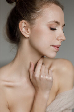 Portrait of a young pretty woman indoor in studio, skin wellness
