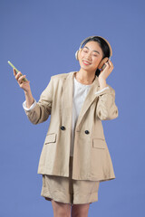 Happy woman with wireless headphones in her ea