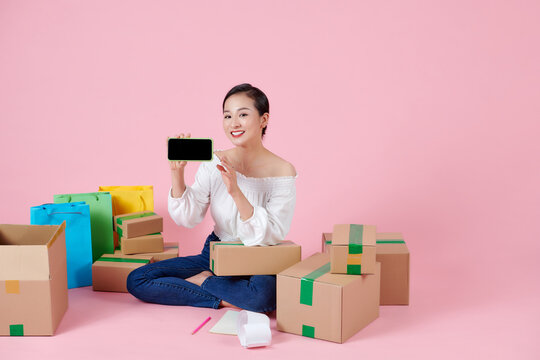 Happy Young Asain Entrepreneur Woman Showing Blank Screen Smartphone For Business Online Content