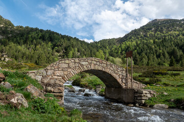 Bridge the Vall de Incles in Andorra in spring 2022. - obrazy, fototapety, plakaty