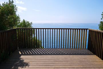 Fototapeta na wymiar Viewpoints and walkways to look at the sea from the top of a balcony, on a sunny summer day.