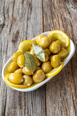 Green olives stuffed with cheese. Cheese filled olives for breakfast on wood floor background. Healthy food. close up