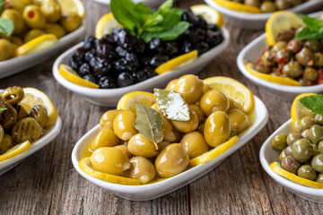 Olives. Varieties of olives on wood background. Healthy food. Selective focus olive. close up