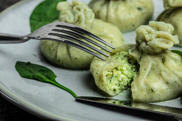 Khinkali with cheese and spinach dumplings. cooking khinkali. National Georgian cuisine. Food recipe background. Close up