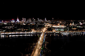 Aerial view of old buildings, castles and a church in the old city of Warsaw. Cityscape of old buildings and architecture in the old town in Warsaw. Night time