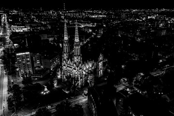 Aerial view of old buildings, castles and a church in the old city of Warsaw. Cityscape of old buildings and architecture in the old town in Warsaw. Night time