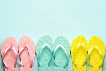 Summer holiday concept.Top view of colored beach flip flops with space for text