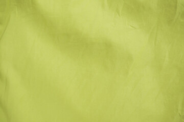 Obraz na płótnie Canvas yellow silk fabric background, yellow cotton cloth texture