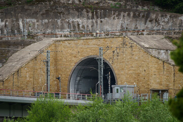 Entrance to railway tunnel in mountains