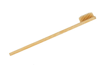 Wooden toothbrush on a white background, top view, isolate