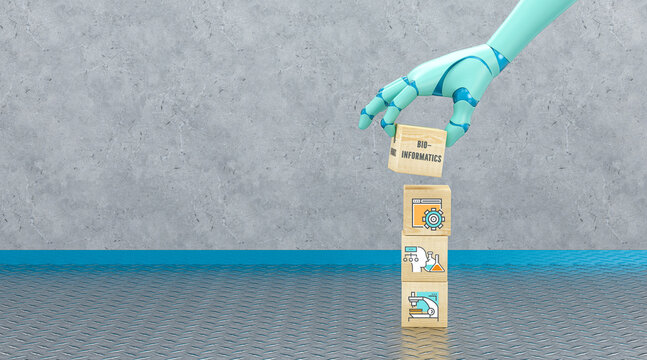 robot hand holding cube with message BIO INFORMATICS in front of a concrete wall
