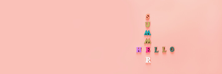 Text from wooden letters Hello summer on an orange background. Summer time concept. New season. Summer greeting. Banner.
