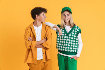White two teenagers smiling while posing together