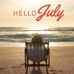 Composite of hello july text and person wearing hat relaxing on deckchair at beach during sunset