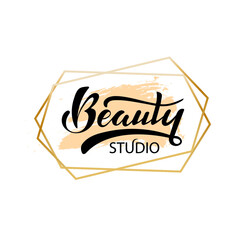 Beauty studio. Digital hand lettering. Logo for company cosmetic business packaging. Black letters on the pastel popcorn color in golden hexagonal frame. Fashion luxury logotype emblem.