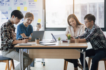 Group meeting of young startup entrepreneurs in the office to discuss strategic marketing and business planning.
