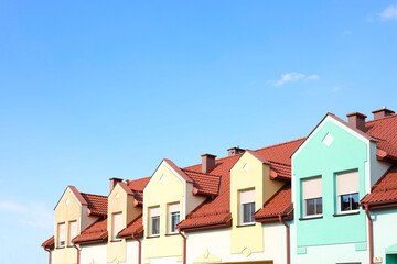 Block of houses outdoors on sunny day