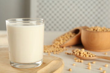 Fresh soy milk and beans on table. Space for text