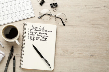 Flat lay composition with to do list on wooden table, space for text
