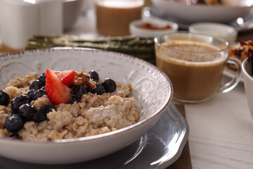 Oatmeal with fruits and nuts served on buffet table for brunch