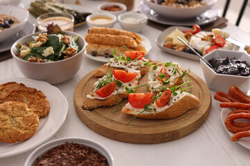 Many different dishes served on buffet table for brunch