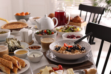 Many different dishes served on buffet table for brunch