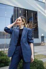 Fototapeta premium Portrait of a pretty business woman in a formal suit