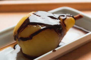 Healthy keto. Hospital and restaurant lunch meal. Fresh fruits citrones, appels, grape. Vitamins and trace minerals and phytonutrients. Pear with chocolate sauce.