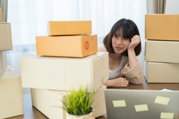 Young Asian business entrepreneur stress in online business, failure woman with working problem. SME entrepreneur