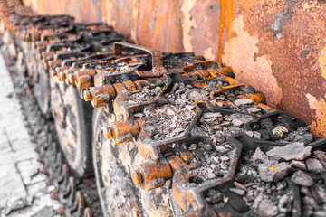 Burnt remnants of military equipment. The war in Ukraine. Rusty tanks of the Russian army. Rusty grunge background. Russia's aggression. Broken Russian equipment. Transport at war. Combat equipment. 
