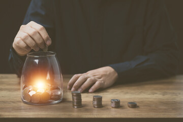  financial and investment concept ,man's hand financial and account numbers to invest money, make a marketing plan income and expenses