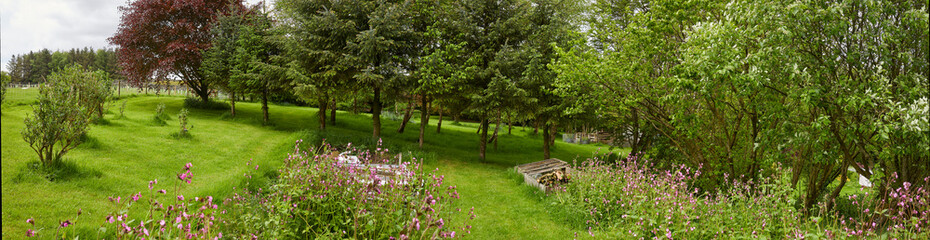 Fototapeta premium Panoramic view of moorland smallholding garden at 900ft
