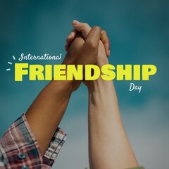 Composite of hands of multiracial friends holding hands and international friendship day against sky