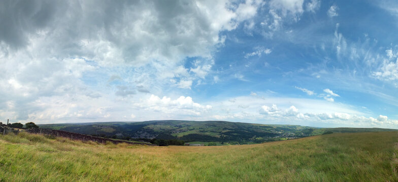 wide panoramic view of the calder valley showing hebden bridge, heptonstall and old town surrounded by west yorkshire countryside
