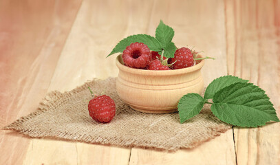 Raspberri berry with leaves. Ripe red raspberries fruits , close up.