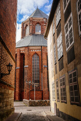 Riga, Latvia, 14 October 2021: St. Peter's church or cathedral with clock and bell tower, parish church of the Evangelical Lutheran, Northern Gothic Style with octagonal spire, tallest spire