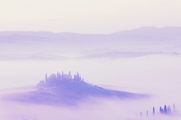 Fototapeta premium Sunrise with fog over a valley in Tuscany - Italy VIII
