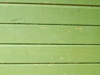 Background of a wooden fence painted green. Green boards. - 506668979