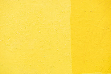 Yellow wall texture. Background yellow paint on wall. Bright color.