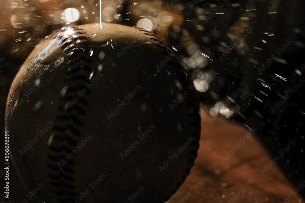 Poster water splash on old baseball for rain delay game concept during night with closeup of wet ball. - Posters