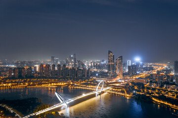 Fototapeta na wymiar Aerial night view of the city skyline of Nanjing Youth Olympic Center and Nanjing Eye Bridge in Nanjing, Jiangsu, China