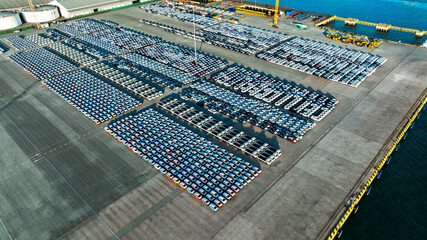 Aerial view a lot of new car for import and export shipping by ship; Smart dealership at car depot;...